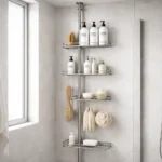 Tension pole shower caddy in a small apartment shower holding shampoo and body wash bottles.